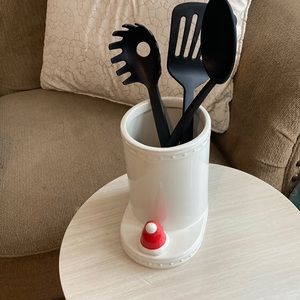 Nora Fleming utensil crock with interchangeable decorative ornament.